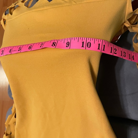 Brand: Another Story
Product: Fitted Mini Dress w/Diamond Peek-A-Boo Sleeves - Picture 9 of 11